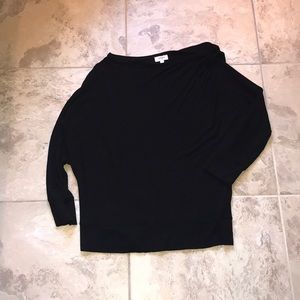 Black long sleeve asymmetric detail at top.